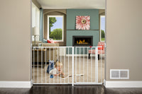 Child reads on floor behind the Maxi Super Wide Baby Gate