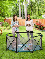 Children play in the Eight Panel My Play® Portable Play Yard in the grass