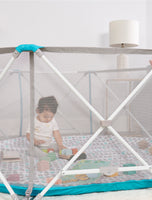 Baby plays in 8-panel My Play Portable Play Yard® with Pad