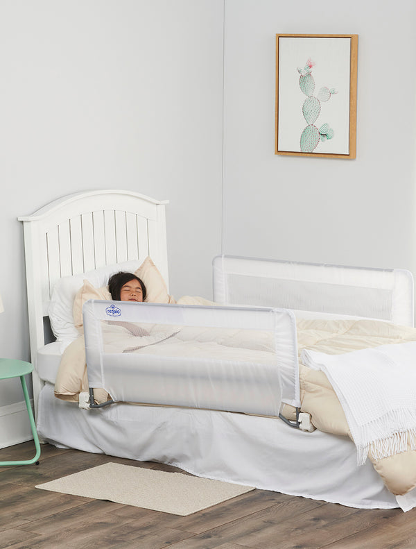 Child sleeps behind Double Sided Swing Down Bed Rail