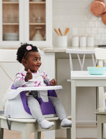 Child eating in My Little Seat® 2-in-1 Floor and Booster Seat - Purple