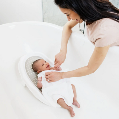 Mother bathing child