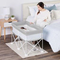 Mom watching over baby while they sleep in the My Crib 