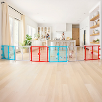 Family in kitchen playing behind plastic safety gate