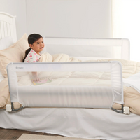 Child sitting up in bed with bedrails