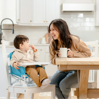 Toddler Sitting at Table with Mom 