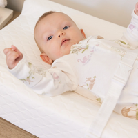 Baby laying on the infant changing pad