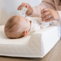 Closeup of contoured side of infant changing pad