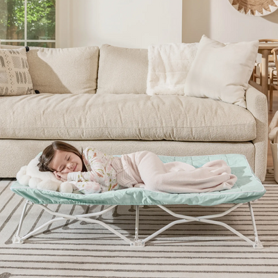 Toddler Sleeping on Quilted My ot in Living Room