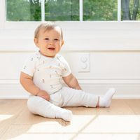 Baby Sitting in front of outlet plugs