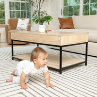 baby crawling by coffee table with clear corner cushions