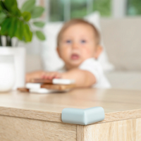 Close-up of Corner Cushion with baby in the background
