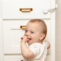 Toddler in Front of Multi-Purpose Lock