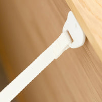 Close-up of furniture strap attached to the dresser