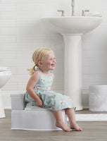 Child smiles sitting on My Little Potty®