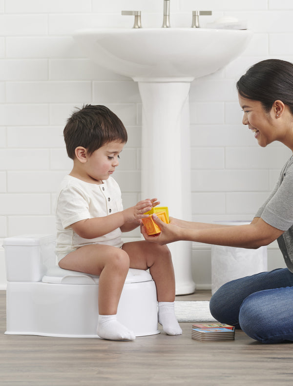 Child plays with toy on My Little Potty®