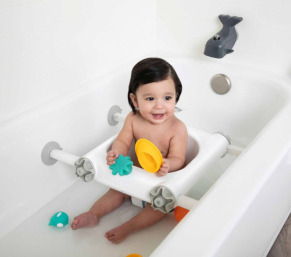 Happy child plays in the Baby Basics™ Bath Seat