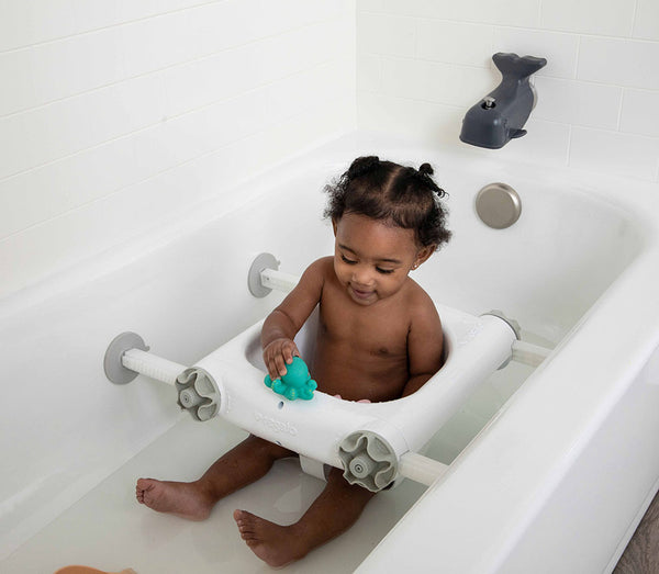 Child plays in Baby Basics™ Bath Seat