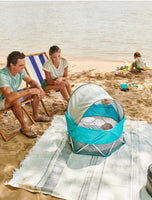 My Play Baby Portable Infant Bassinet at the beach
