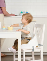 Baby Basics™ Booster Seat strapped to chair