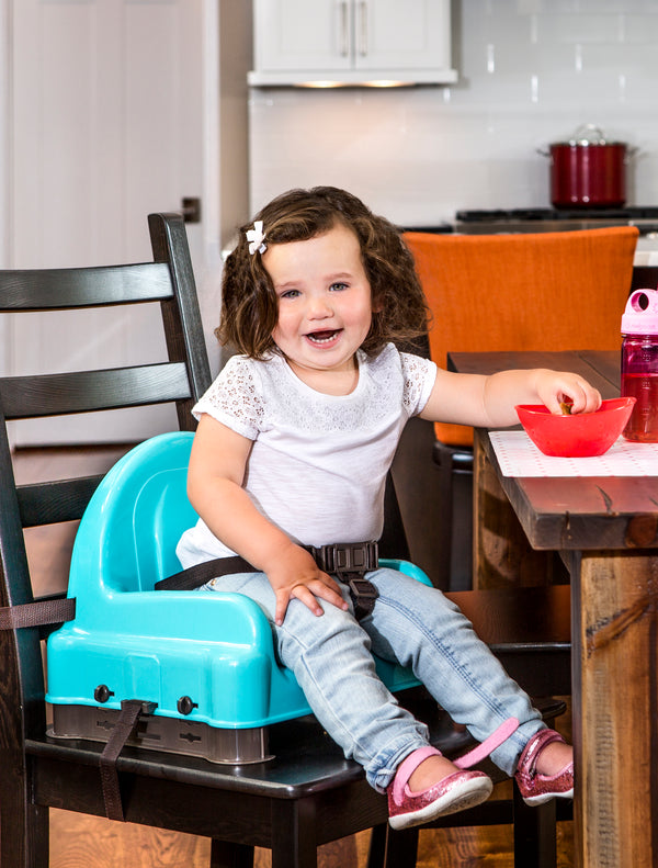 Child smiling in Right Height Adjustable Booster Seat