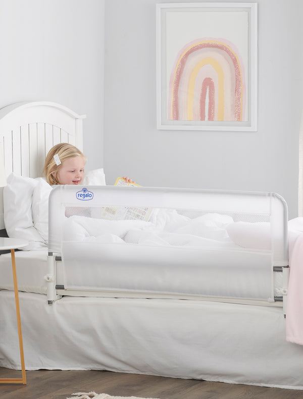 Child reads behind Easy Slide Bed Rail