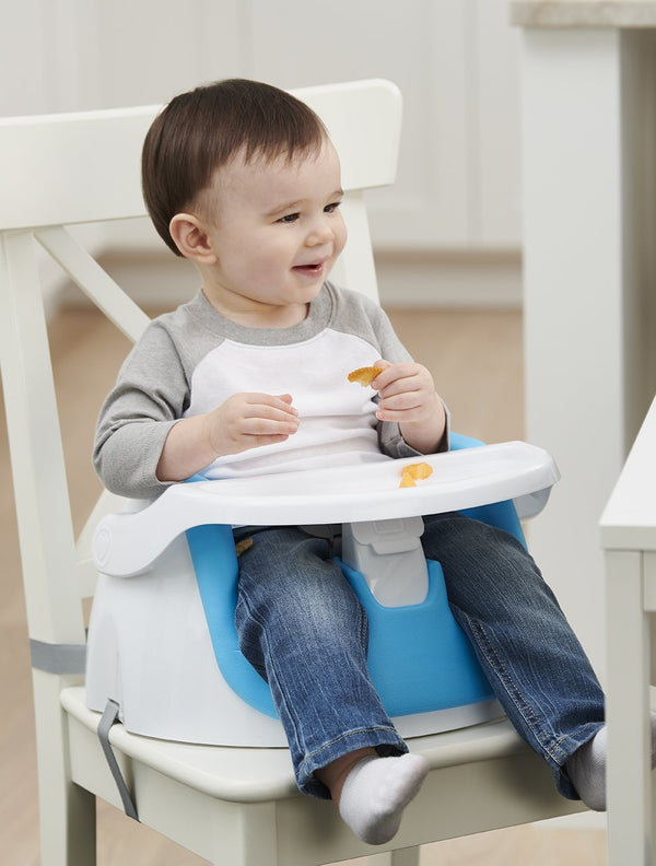 Child eats in blue My Little Seat® 2-in-1 Floor and Booster Seat