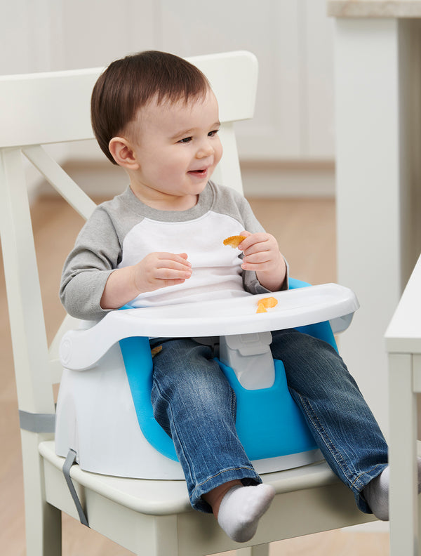 Child sits in My Little Seat® 2-in-1 Floor and Booster Seat - Blue