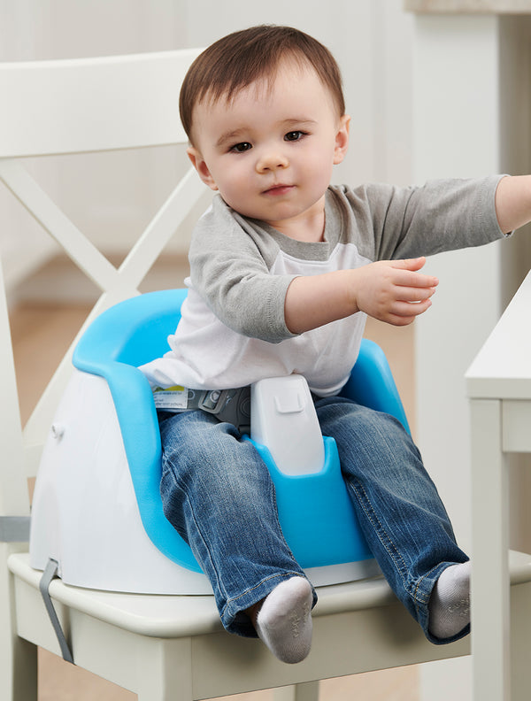 Child sits in My Little Seat® 2-in-1 Floor and Booster Seat in Blue