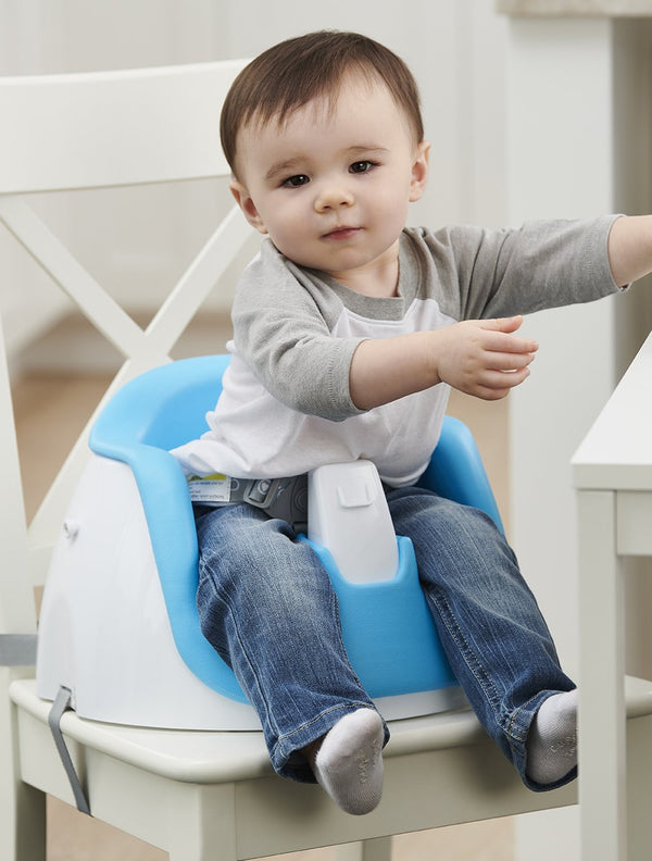 Child reaching in blue My Little Seat® 2-in-1 Floor and Booster Seat