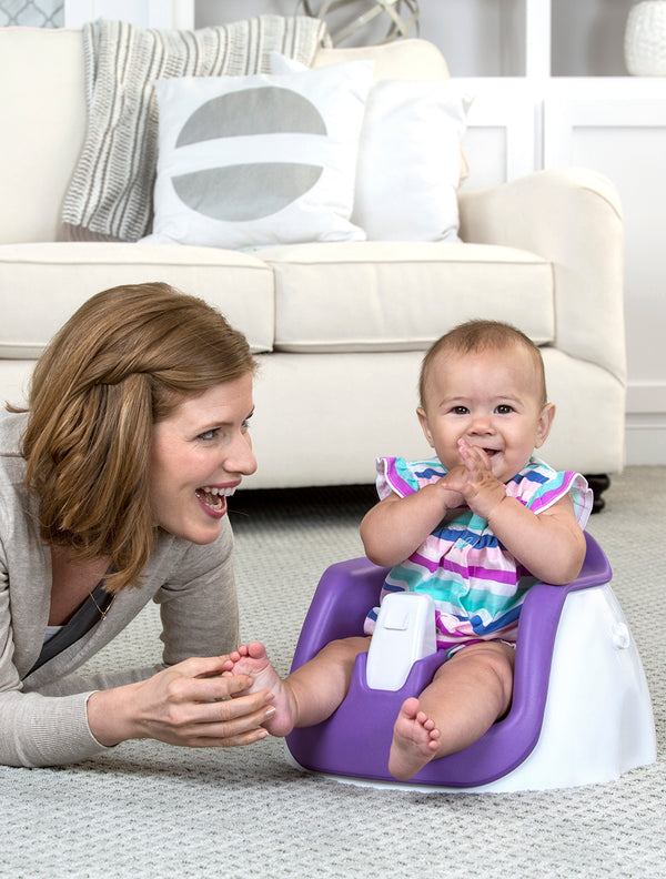 Baby sits in My Little Seat® 2-in-1 Floor and Booster Seat - Purple