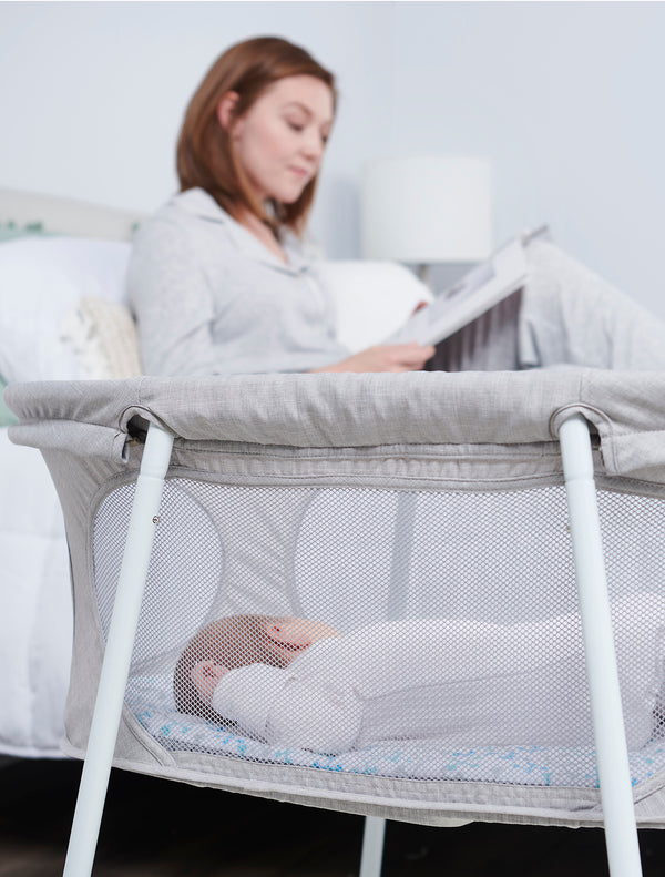 Baby naps in the Baby Basics™ Infant Bassinet
