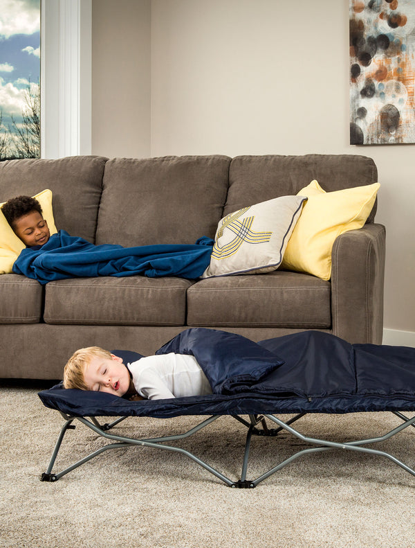 Child sleeps on the Deluxe My Cot® Portable Toddler Travel Bed™
