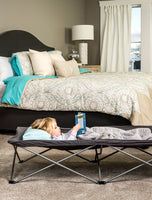 Child reads on Gray Extra Long My Cot® Portable Toddler Bed™