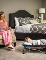 Child naps on Gray My Cot® Portable Toddler Bed™