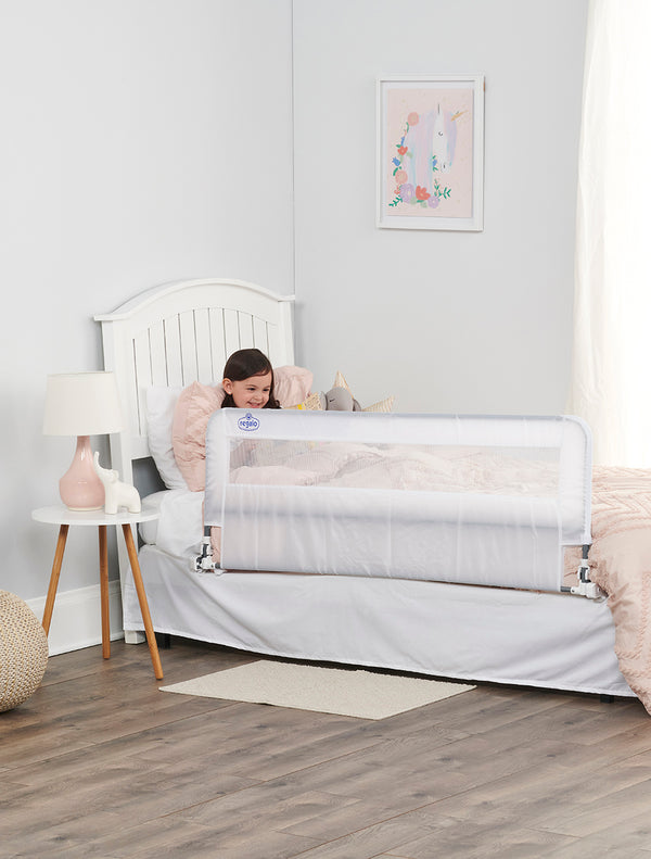 Child sits by HideAway Extra Long Bed Rail