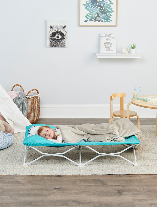 Child sleeping on the My Cot® Pals Portable Toddler Bed Teal Bear