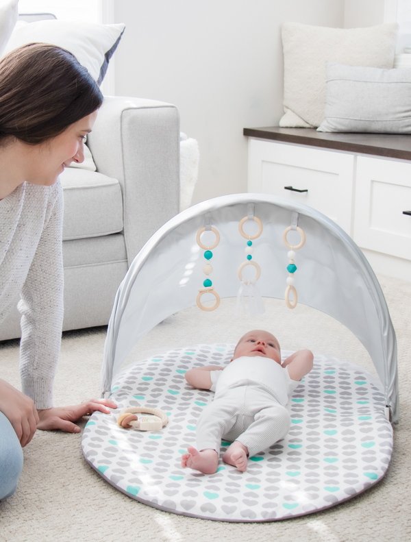 Baby relaxing on Baby Basics™ Foldable Infant Play Mat